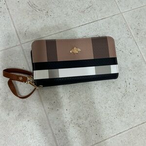 Elegant Striped Wallet with Gold Bee Emblem